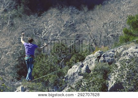 Man Balancing On The Rope Concept Of Risk Taking And Challenge.