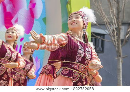 Almaty, Kazakhstan - March 23, 2019.beautiful Girls In National Kazakh Costumes Dance On The Street 