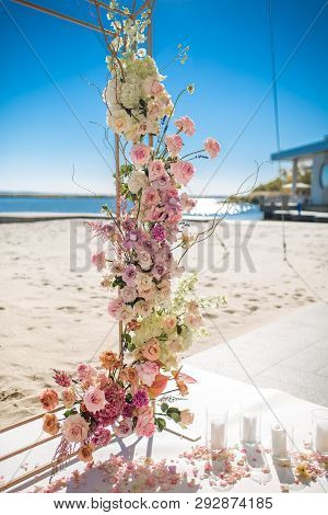 Event Decoration. Wedding Chuppa At Riverside Decorated With Fresh Flowers. Florist Workflow.