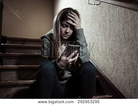 Beautiful Lonely Young Girl Depressed And Worried Suffering From Bullying And Harassment At School
