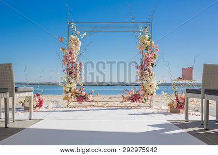 Event Decoration. Wedding Chuppa At Riverside Decorated With Fresh Flowers. Florist Workflow.