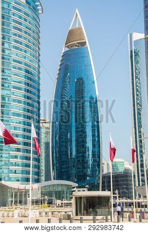 Doha, Qatar - December 14, 2018: Woqod Tower Building With Glass Facade In Doha, Qatar Among Other S