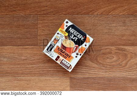 Nescafe Caramel Cream Coffee Sticks Box On Wooden Background. Nescafe Is A Brand Of Coffee Made By N