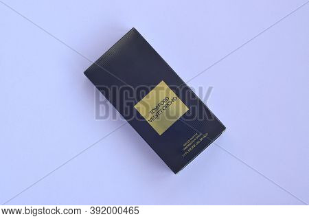 Tom Ford Velvet Orchid Fragrance Perfume Bottle Lies On Light Lilac Background. Tom Ford Is American