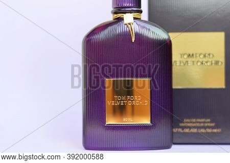 Tom Ford Velvet Orchid Fragrance Perfume Bottle Lies On Light Lilac Background. Tom Ford Is American