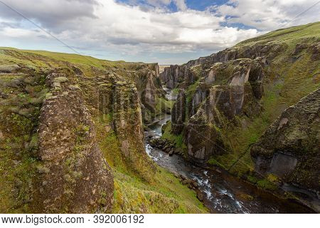 River Flowing Through Fjarrgljfur Canyon In Iceland, Europe.