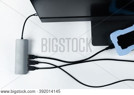 Adapter With Connection Of External Hard Drives Connected To A Monoblock On A White Background.compu