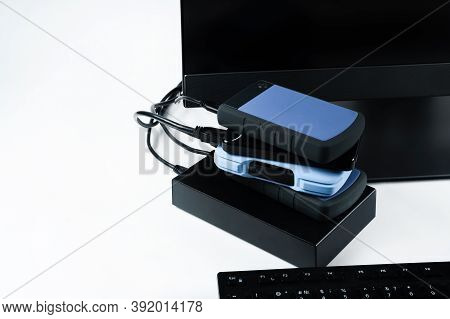 Multiple External Hard Drives Connected To A Monoblock On A White Background.computer With Hard Driv