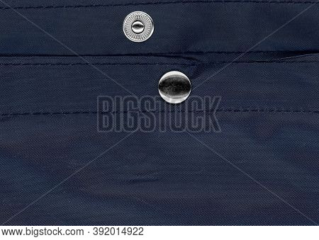 Snap Fastener On Blue Bag Fabric Texture