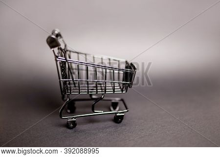 Black Empty Shopping Cart On Gray Background