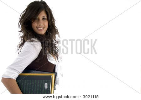 Porträtt av collegestudent håller studiematerial