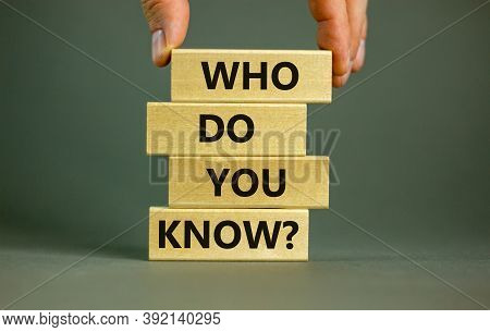 Male Hand Placing A Block With Word 'who' On A Blocks Tower With Words 'who Do You Know'. Beautiful 
