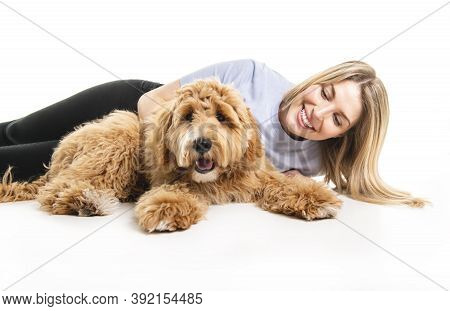 Woman With His Golden Labradoodle Dog Isolated On White Background