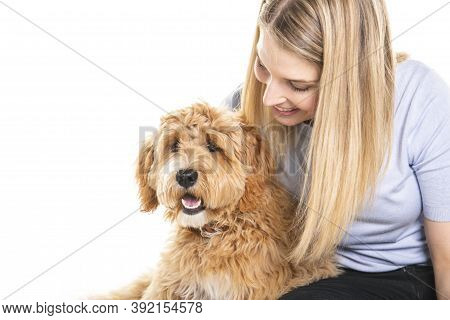 Woman With His Golden Labradoodle Dog Isolated On White Background