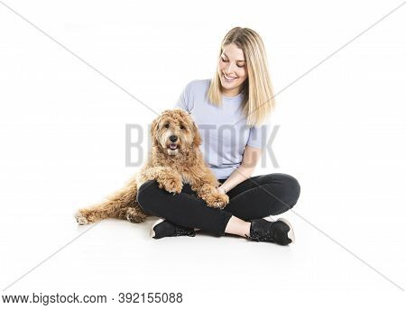 Woman With His Golden Labradoodle Dog Isolated On White Background