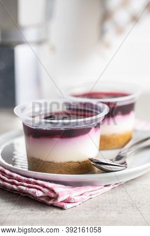 Sweet desssert. Cheesecake cup on plate.
