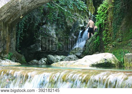 Rocky Bridge Of Candalla Over The River Waters In The Tuscan Mountains In Italy On Summer