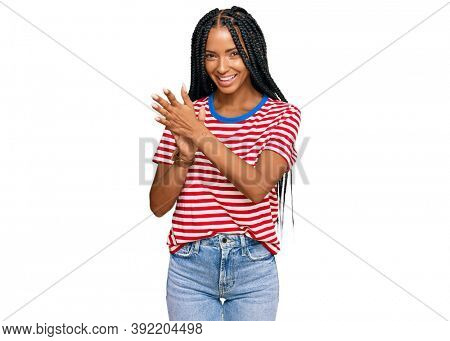 Beautiful hispanic woman wearing casual clothes clapping and applauding happy and joyful, smiling proud hands together 