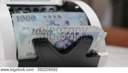 Money counter machine counting New Taiwan dollar