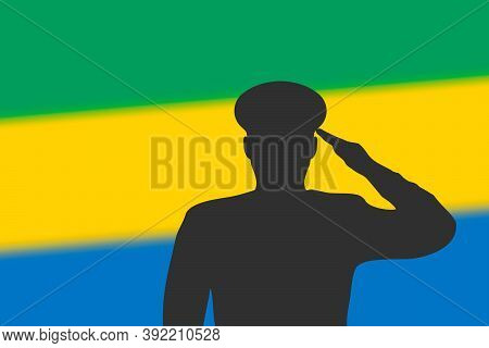 Solder Silhouette On Blur Background With Gabon Flag.