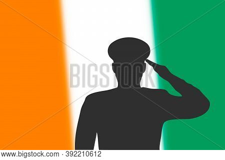 Solder Silhouette On Blur Background With Ivory Coast Flag.