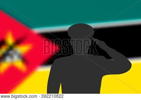 Solder Silhouette On Blur Background With Mozambique Flag.