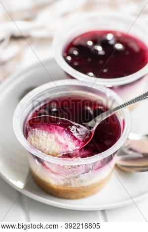 Sweet desssert. Cheesecake cup on plate.