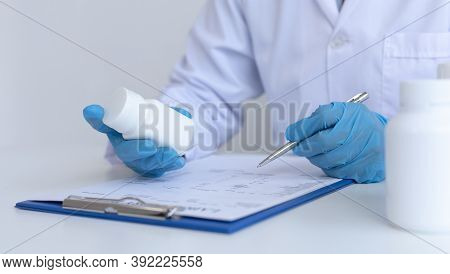 Closeup portrait, Scientists in white lab coats are analyzing the vital substance of the sample drug