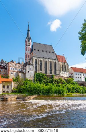 St Vitus Church In The Middle Of Historical City Centre. View From Vltava River. Cesky Krumlov, Sout