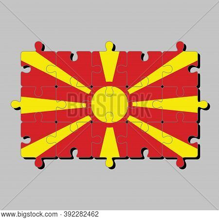 Jigsaw Puzzle Of Macedonia Flag In Yellow Sun On A Red Field, With Eight Broadening. Concept Of Fulf