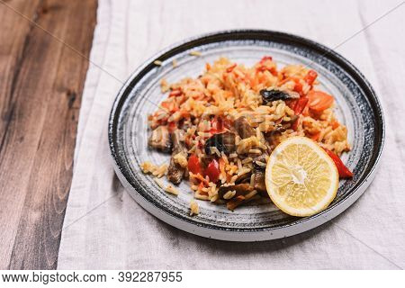 Arroz Con Verduras Y Azafran, Spanish Dish. Vegetarian Risotto With  Vegetables, Champignons And Saf