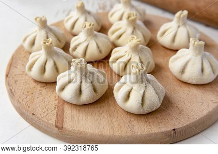 Baked homemade  cheese pie on wooden background. Bulgarian banitsa, Georgian khachapuri, Greek tirop