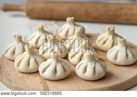 Baked homemade  cheese pie on wooden background. Bulgarian banitsa, Georgian khachapuri, Greek tirop