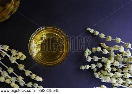 Cups Of Herbal Tea On A Black Background. Tatar Tea Or Lemongrass.
Top View With Space For Text.