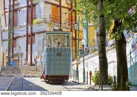 Lisbon, Portugal - June 13, 2013: Carriage Of Gloria Funicular Decorated With Azulejos Tiles In Pomb
