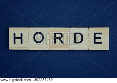 Gray Word Horde From Small Wooden Letters On A Black Table