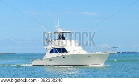 Port Aransas, Tx - 29 Feb 2020: Angled View Of A Beautiful White Fishing Yacht Boat Sails On The Cal