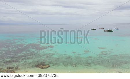 Seascape: Tropical Beach With Coral Reef And Turquoise Sea With Boats. Alorro Beach, Philippines, Sa