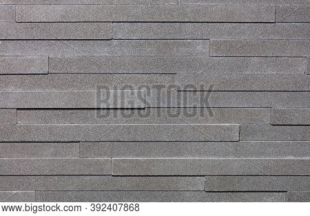 Beautiful Mosaic Of Granite Panels With A Uniform Texture Of Ashy Color.