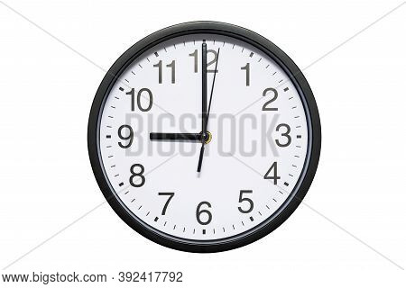 Wall Clock Shows Time 9 O'clock On White Isolated Background. Round Wall Clock - Front View. Twenty 