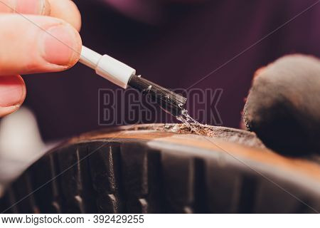 Glue Application With A Brush, Shoe Repair.