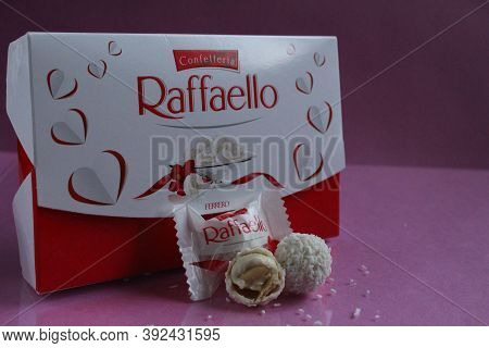 White Candies Round And Halves In The Background Is A Square Rectangular Gift Box Raffaello Stands O