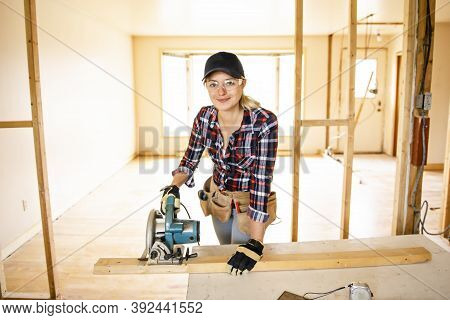 A Woman Worker In The Carpenter Workroom Renovation