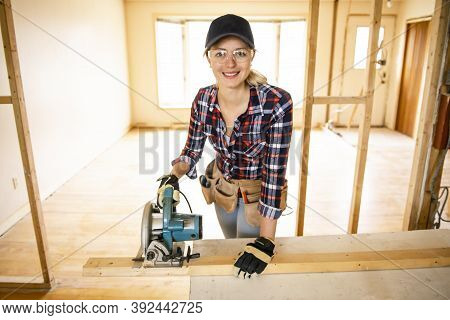 A Woman Worker In The Carpenter Workroom Renovation