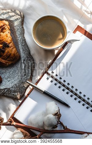 Coffee Mug With Croissant And Empty Notebook And Pencil For Business Plan And Design Ideas Onon Whit