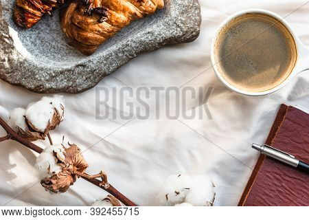 Coffee Mug With Croissant And Empty Notebook And Pencil For Business Plan And Design Ideas Onon Whit
