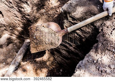 Earthworks. Shovel In The Ground In The Garden. A Bayonet Spade In The Garden. Digging Up The Soil O