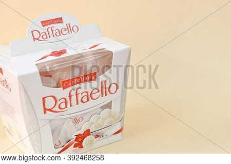 Raffaello Candies On Beige Background. Raffaello Is A Spherical Coconut Almond Confection That Itali