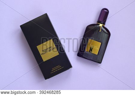 Tom Ford Velvet Orchid Fragrance Perfume Bottle Lies On Light Lilac Background. Tom Ford Is American