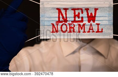 New Normal Word On 3 Ply Face Surgical Mask. Life After Pandemic Concept.